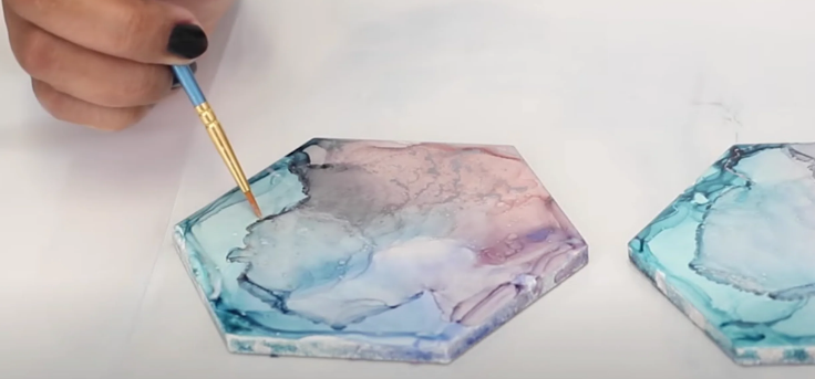 What is the best adhesive for alcohol ink